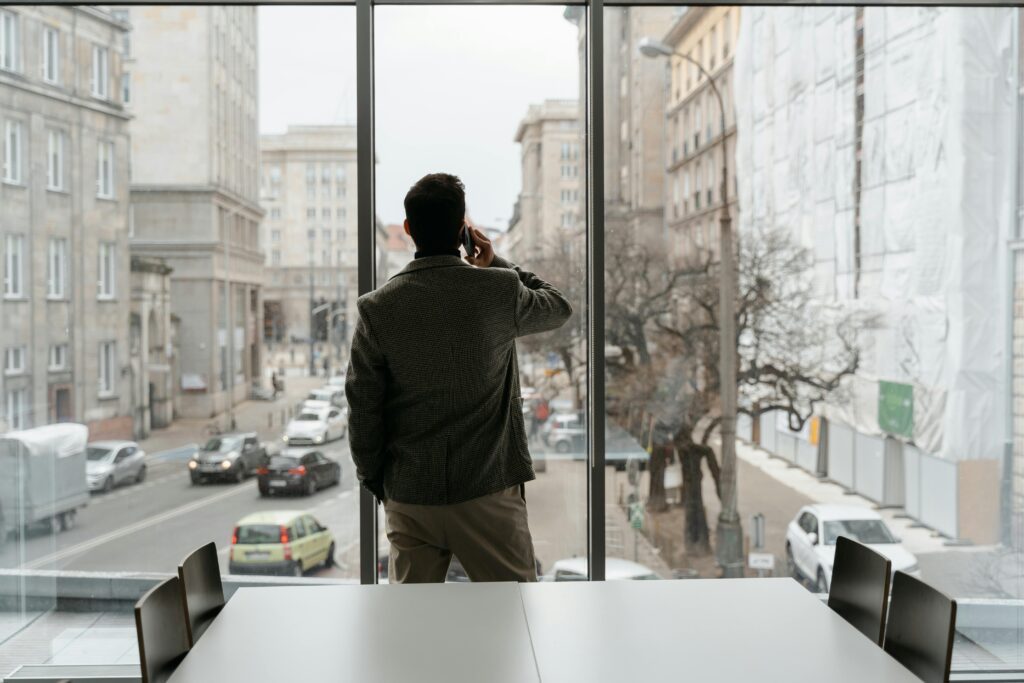 Professional making a phone call in a modern office